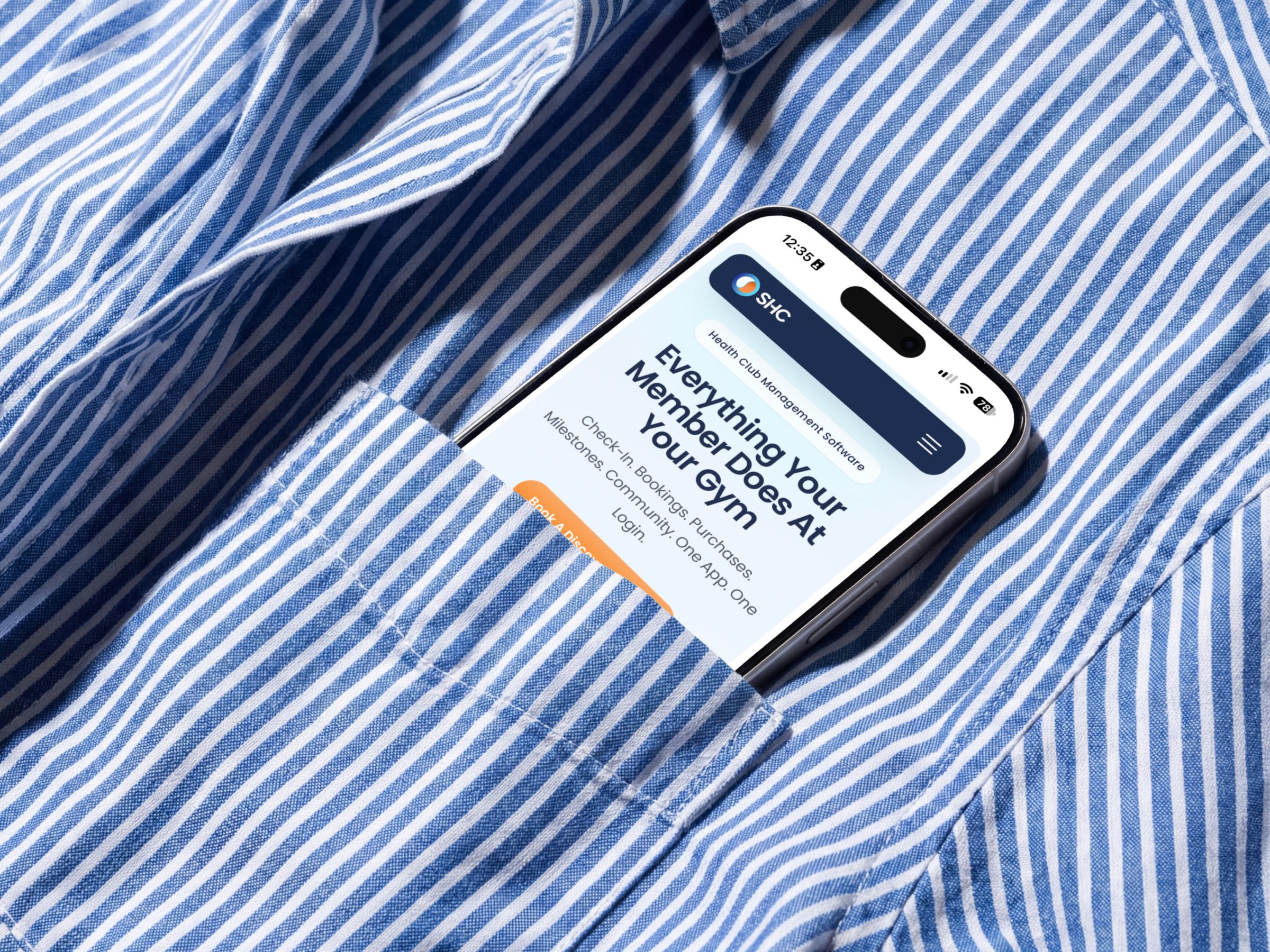 Smart Health Clubs mobile site on a phone tucked into a striped shirt pocket.
