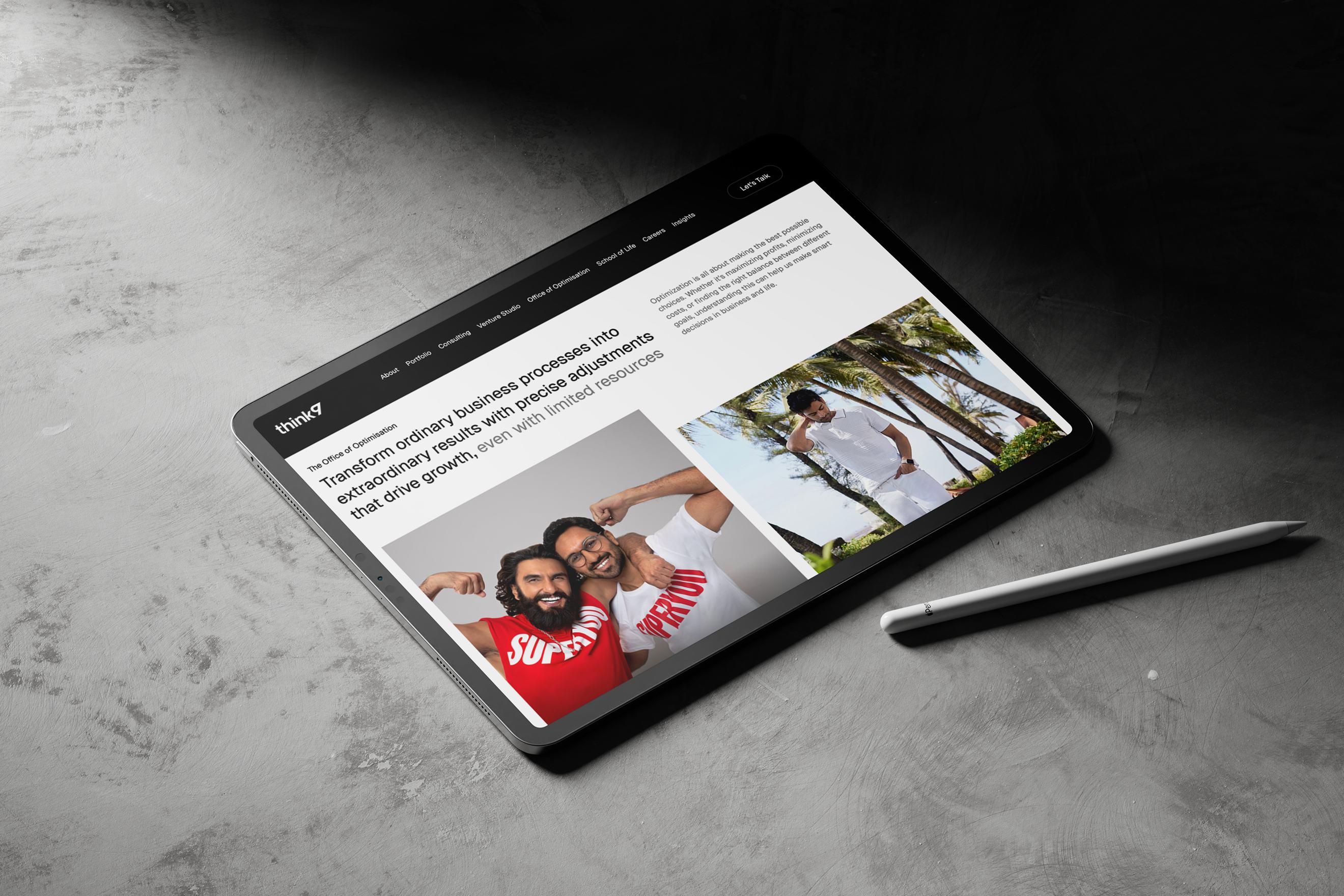 Think 9 website on a tablet lying on a concrete surface next to a stylus.